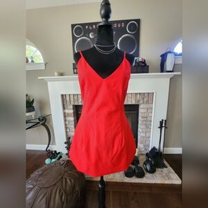 NEW Beautiful red dress mini, with neckline in the back, bags on the sides.